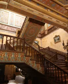 Chandeliers and Hereke carpets in a grand interior hall of Beylerbeyi Palace