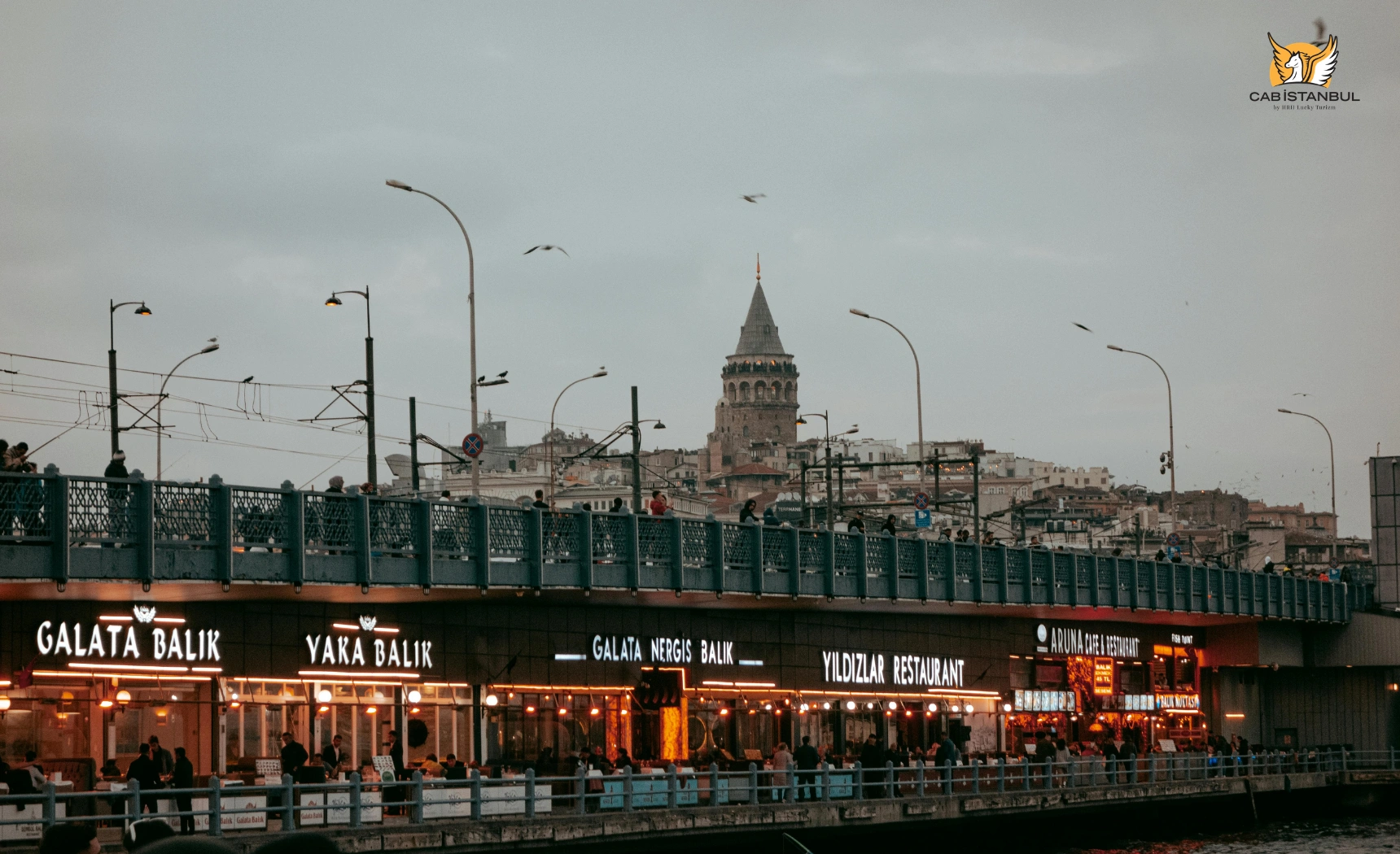 Seafood restaurants lining the lower deck of Galata Bridge over the Golden Horn