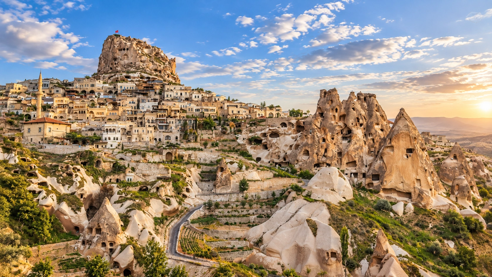 Wide view of Uçhisar and surrounding Cappadocia valleys under clear sky