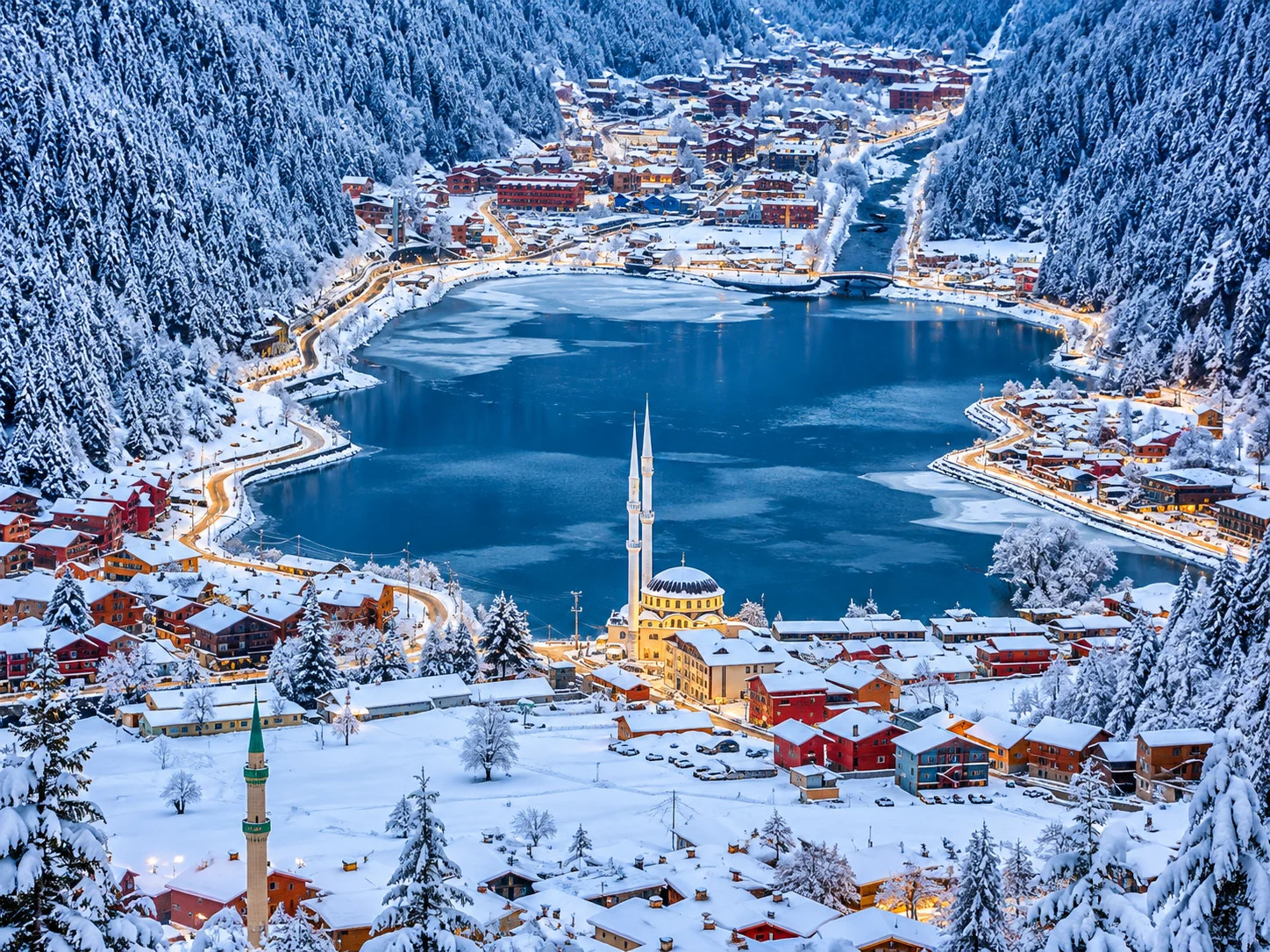 Uzungöl under snow in winter — wooden houses and mosque by the frozen lake, Trabzon